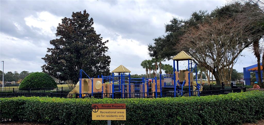 5781 Southwest 39th Street Ocala, FL 34474 - Photo 42 of 45 a view of a big building with a big yard and large trees