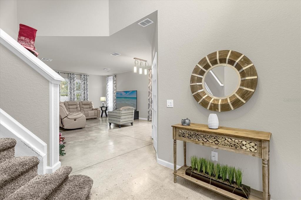 5781 Southwest 39th Street Ocala, FL 34474 - Photo 5 of 45 a view of living room and kitchen