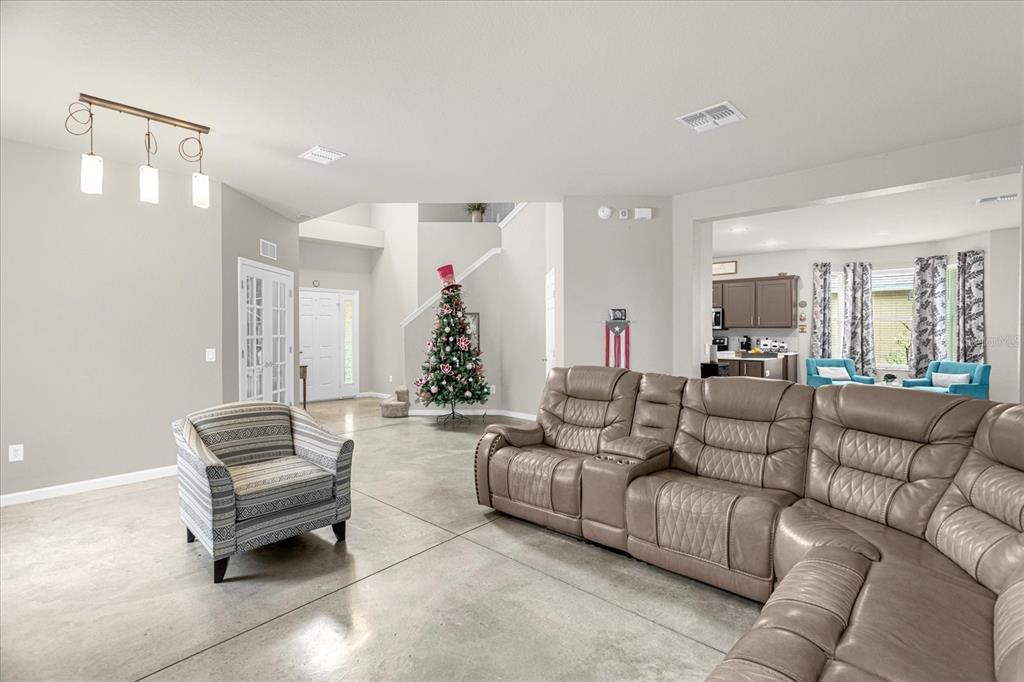 5781 Southwest 39th Street Ocala, FL 34474 - Photo 7 of 45 a living room with furniture and a couch