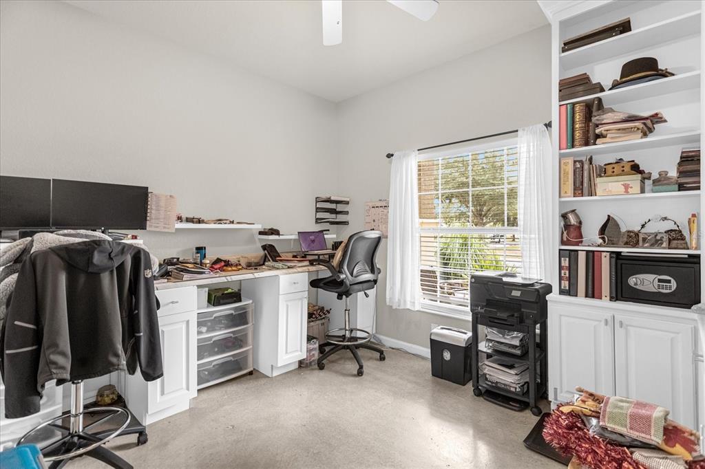 5781 Southwest 39th Street Ocala, FL 34474 - Photo 10 of 45 a view of a workspace with furniture and a window