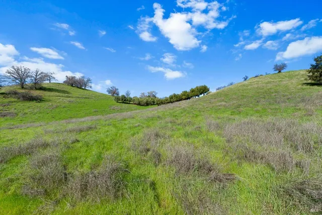 a view of an outdoor space with mountain view and mountains