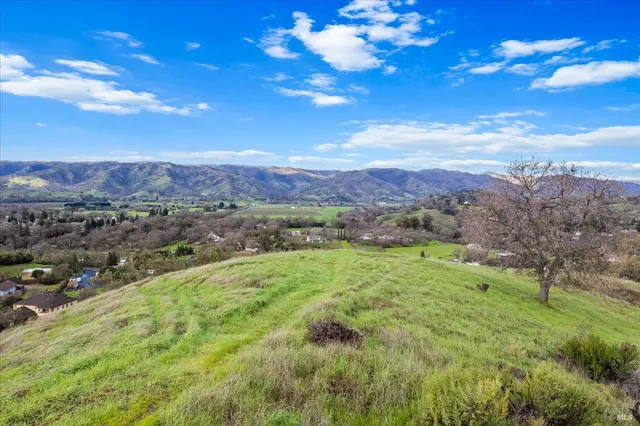 a view of a city with mountains in the background