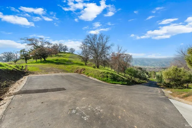 a view of a lake with houses in the back