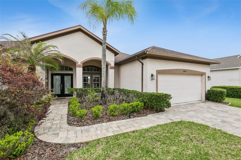 1652 Cherry Ridge Drive Lake Mary, FL 32746 - Photo 1 of 62 front view of a house with a small yard