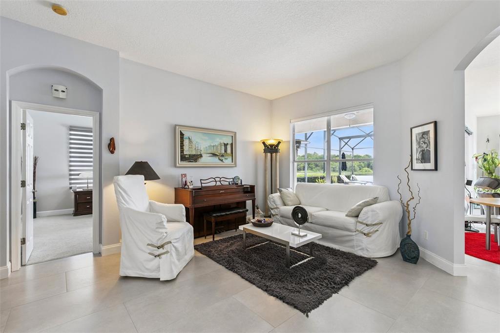 1652 Cherry Ridge Drive Lake Mary, FL 32746 - Photo 11 of 62 a living room with furniture and a large window
