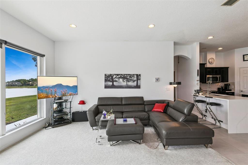 1652 Cherry Ridge Drive Lake Mary, FL 32746 - Photo 13 of 62 a living room with furniture and a flat screen tv