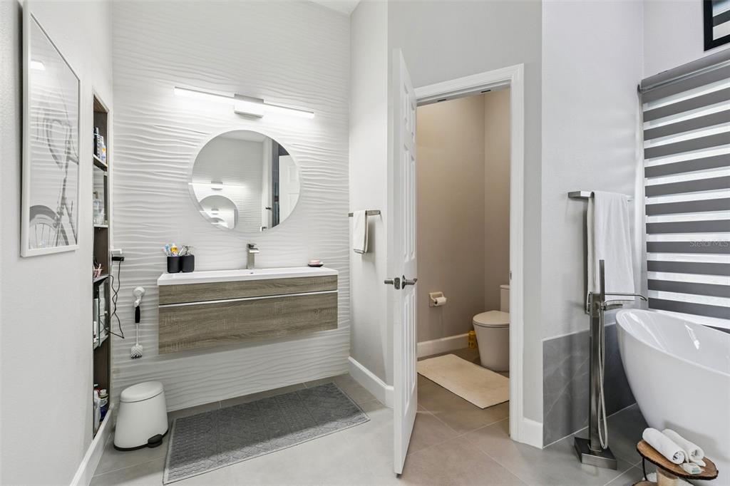 1652 Cherry Ridge Drive Lake Mary, FL 32746 - Photo 24 of 62 a bathroom with a double vanity sink mirror and toilet