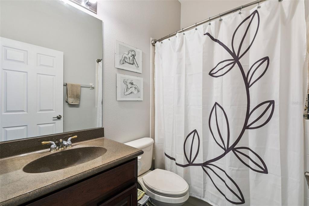 1652 Cherry Ridge Drive Lake Mary, FL 32746 - Photo 31 of 62 a bathroom with a toilet sink and mirror