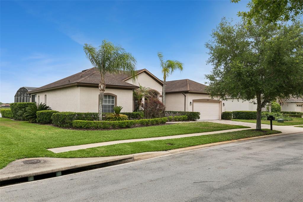 1652 Cherry Ridge Drive Lake Mary, FL 32746 - Photo 4 of 62 a front view of a house with a yard and garage