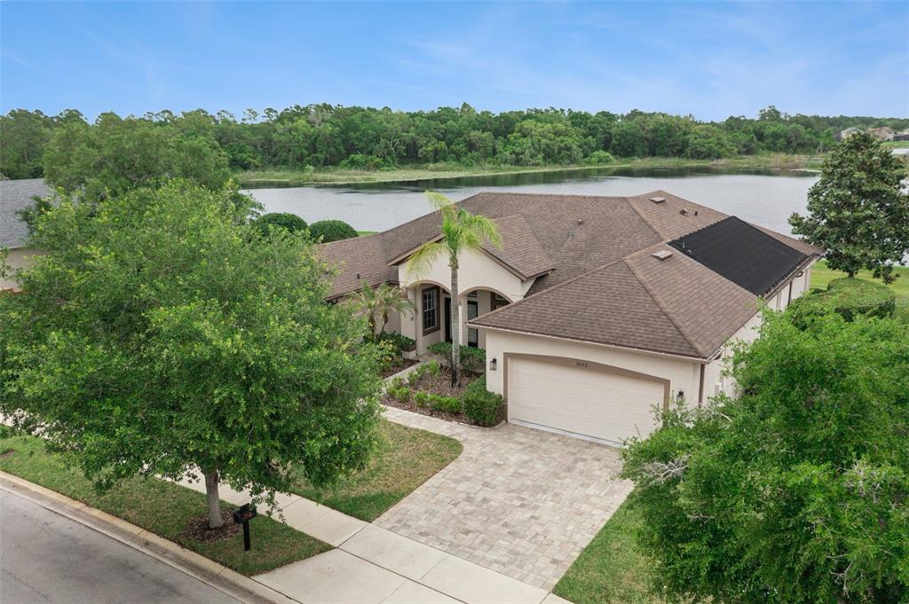 1652 Cherry Ridge Drive Lake Mary, FL 32746 - Photo 41 of 62 an aerial view of a house with a yard and lake view