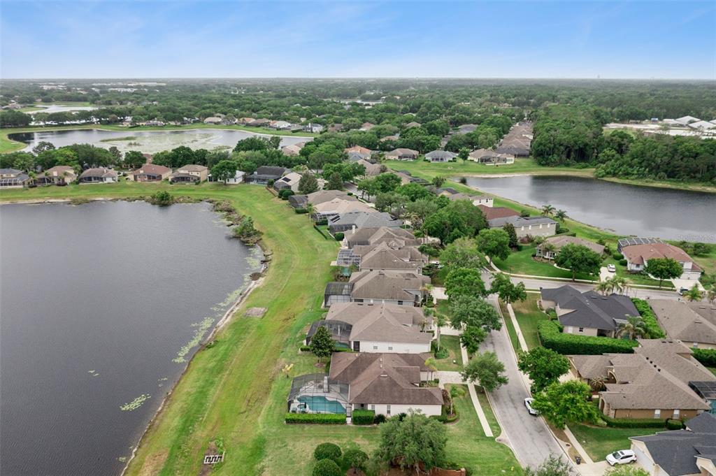 1652 Cherry Ridge Drive Lake Mary, FL 32746 - Photo 49 of 62 an aerial view of residential houses with outdoor space and lake view