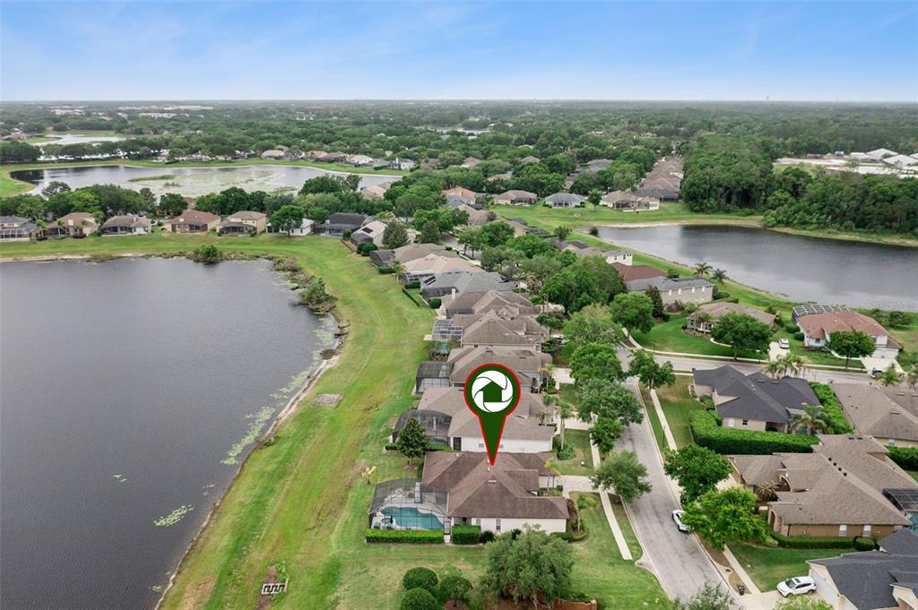 1652 Cherry Ridge Drive Lake Mary, FL 32746 - Photo 50 of 62 an aerial view of a house with a lake view
