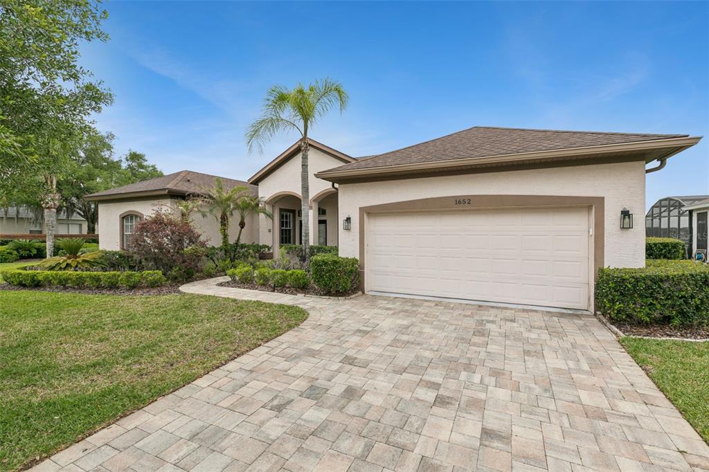 1652 Cherry Ridge Drive Lake Mary, FL 32746 - Photo 6 of 62 a front view of a house with a yard and garage