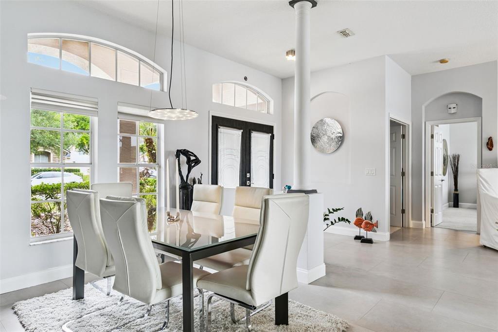 1652 Cherry Ridge Drive Lake Mary, FL 32746 - Photo 8 of 62 a view of a dining room with furniture window and wooden floor