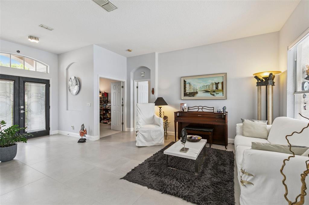 1652 Cherry Ridge Drive Lake Mary, FL 32746 - Photo 10 of 62 a living room with furniture and a fireplace