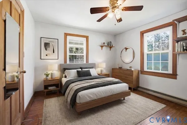 a bedroom with a large bed and a window