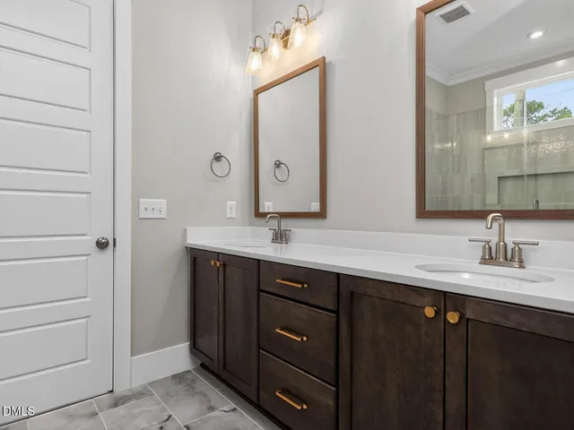a bathroom with a shower and a sink