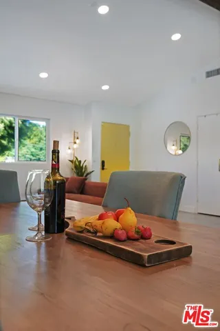 a living room with furniture rug and window
