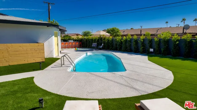a view of a swimming pool with a patio