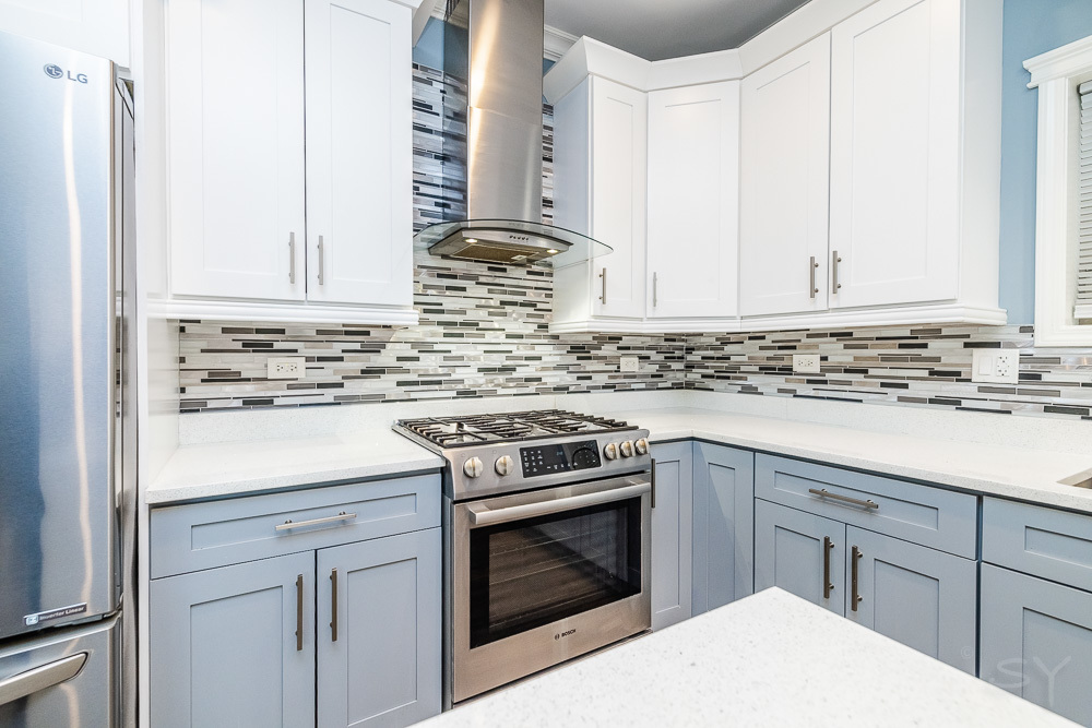 1300 South Heath Avenue Chicago, IL 60608 - Photo 15 of 55 a kitchen with granite countertop white cabinets and white appliances