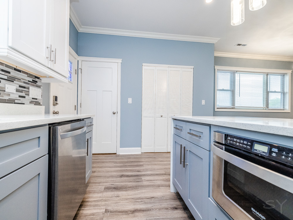 1300 South Heath Avenue Chicago, IL 60608 - Photo 16 of 55 a kitchen with stainless steel appliances cabinets a stove and a window