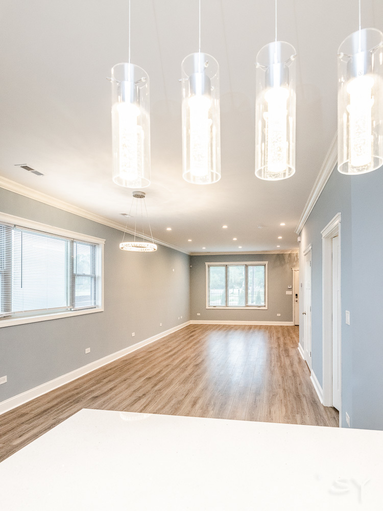 1300 South Heath Avenue Chicago, IL 60608 - Photo 19 of 55 a view of an empty room with wooden floor and a window