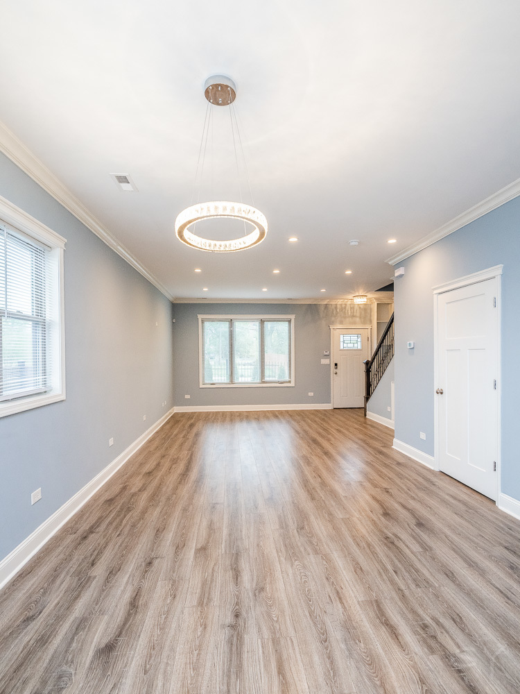 1300 South Heath Avenue Chicago, IL 60608 - Photo 20 of 55 an empty room with wooden floor and windows