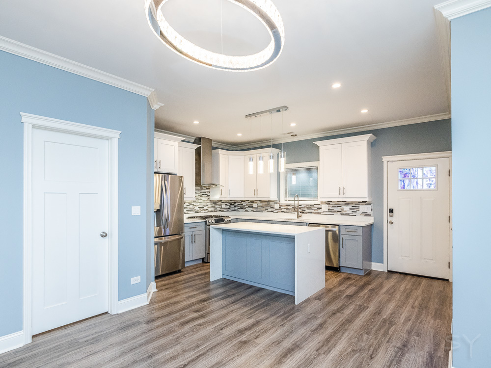 1300 South Heath Avenue Chicago, IL 60608 - Photo 2 of 55 a large kitchen with a stove and a refrigerator