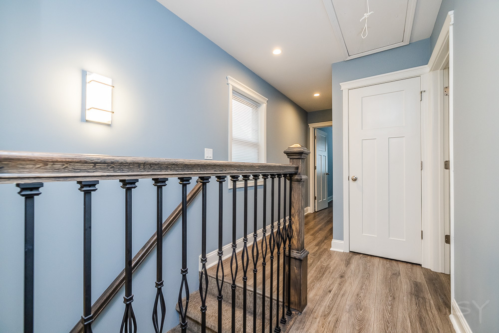1300 South Heath Avenue Chicago, IL 60608 - Photo 28 of 55 a view of a hallway with wooden floor and stairs