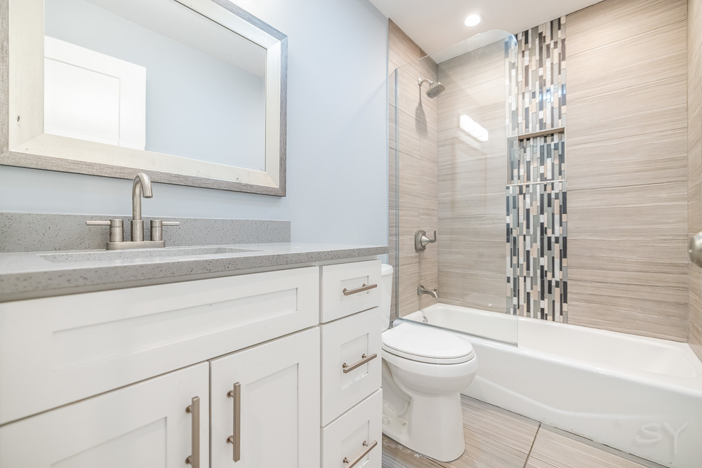 1300 South Heath Avenue Chicago, IL 60608 - Photo 38 of 55 a bathroom with a sink a toilet and shower