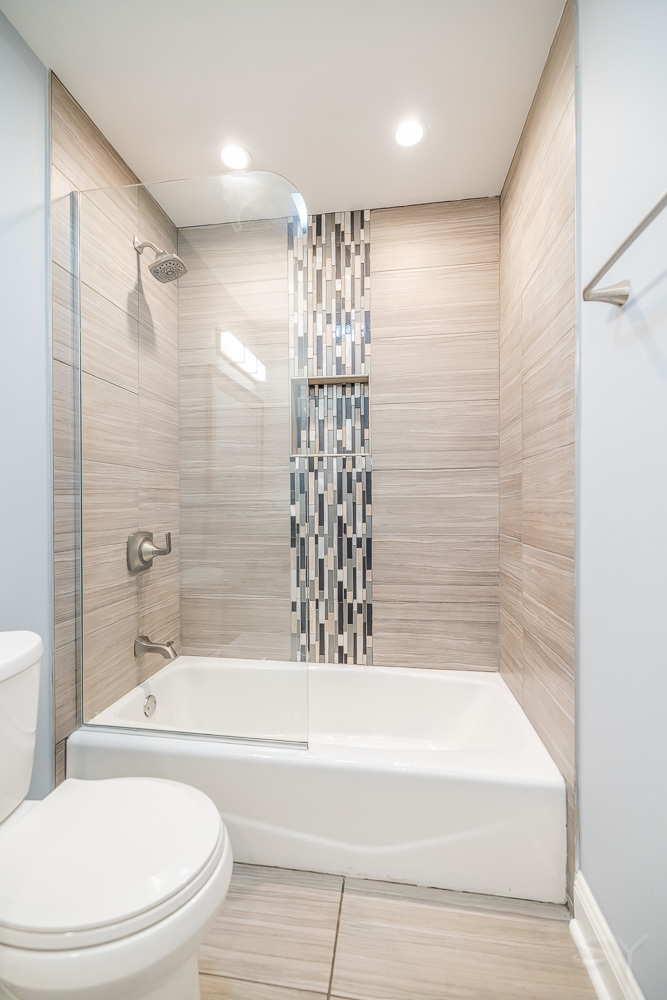 1300 South Heath Avenue Chicago, IL 60608 - Photo 40 of 55 a bathroom with a bathtub toilet and shower