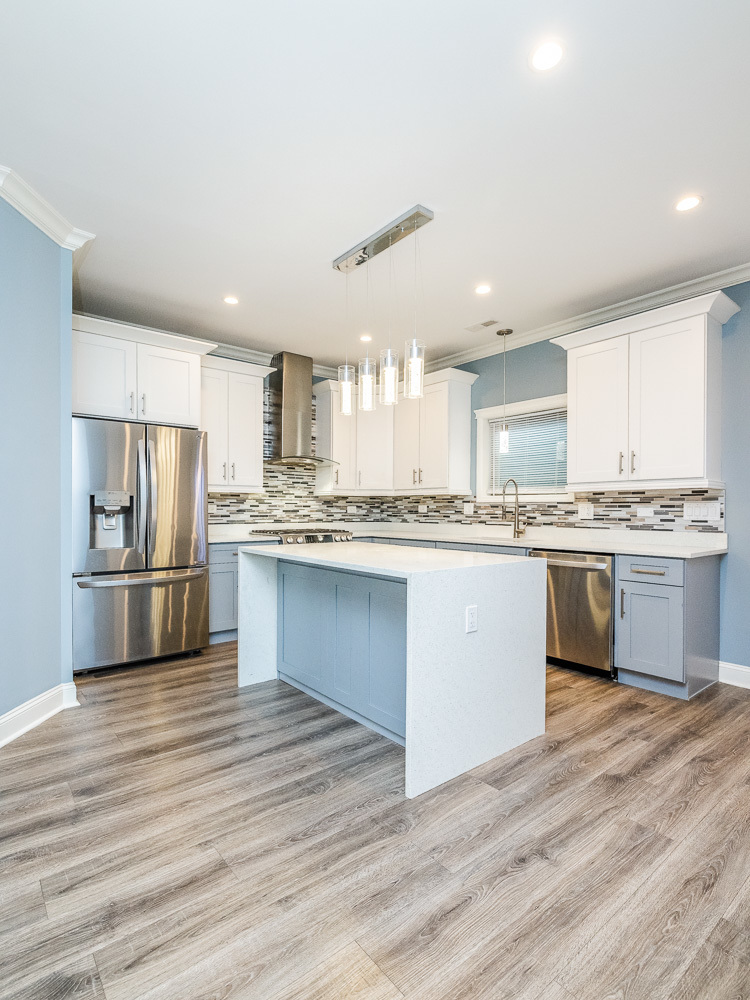 1300 South Heath Avenue Chicago, IL 60608 - Photo 4 of 55 a kitchen with stainless steel appliances a refrigerator sink and cabinets