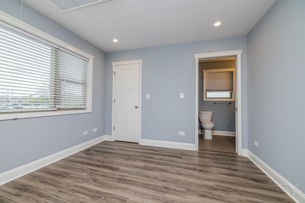 1300 South Heath Avenue Chicago, IL 60608 - Photo 47 of 55 a view of empty room with wooden floor