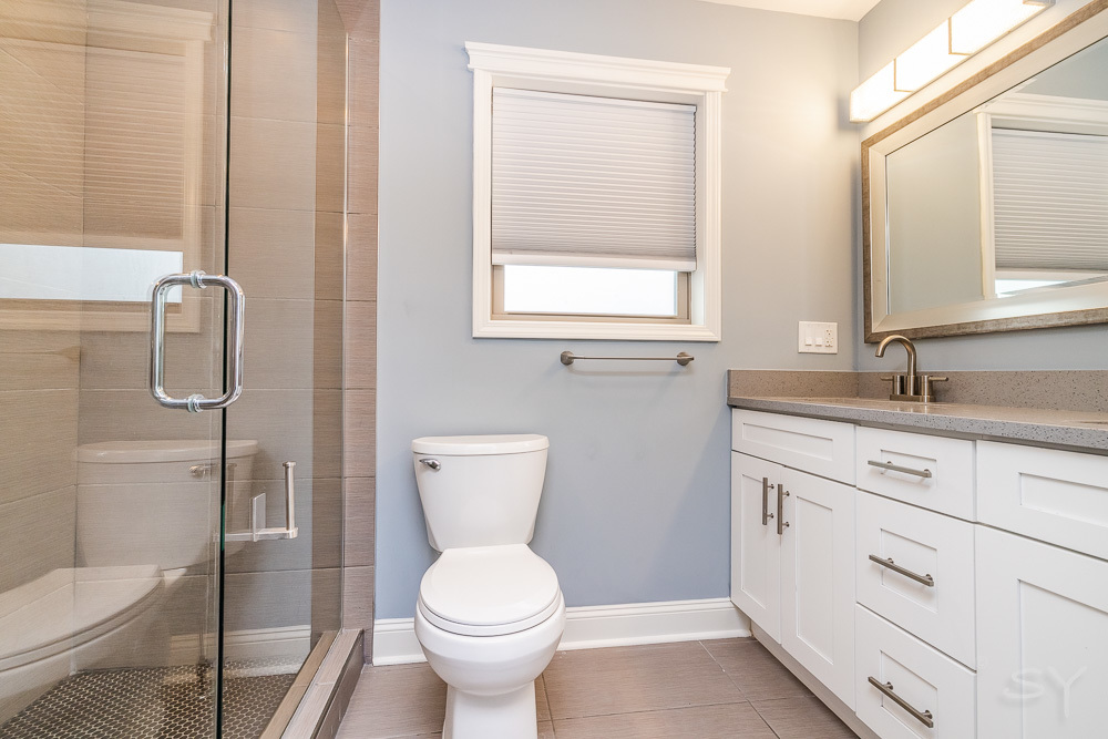 1300 South Heath Avenue Chicago, IL 60608 - Photo 48 of 55 a bathroom with a toilet sink and shower