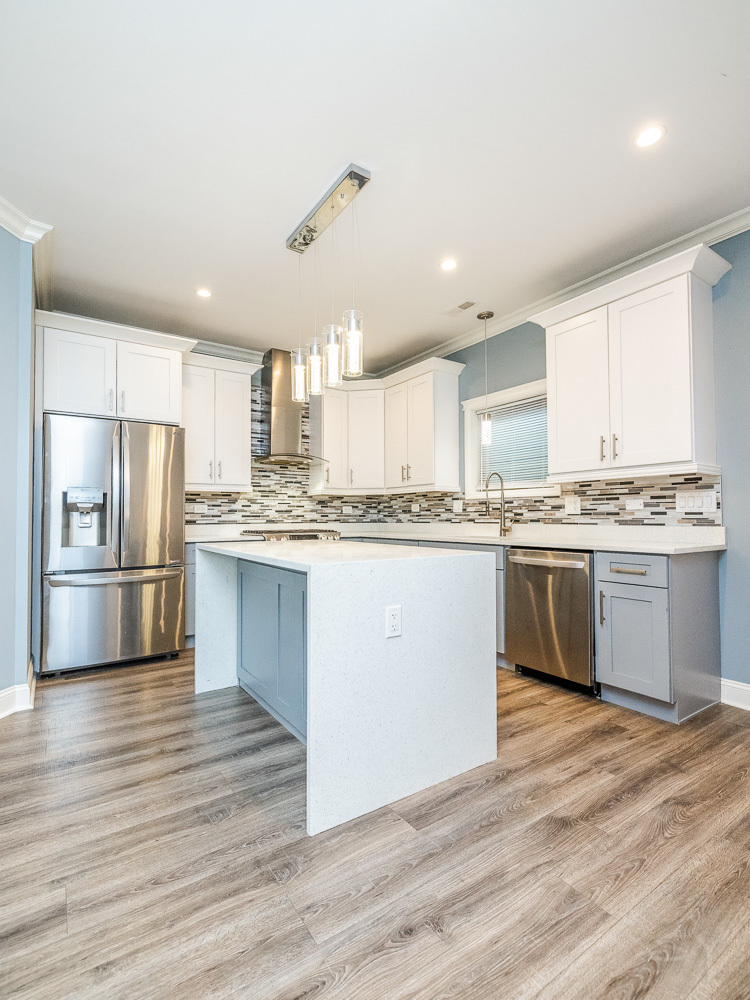 1300 South Heath Avenue Chicago, IL 60608 - Photo 6 of 55 a kitchen with stainless steel appliances a refrigerator sink and cabinets