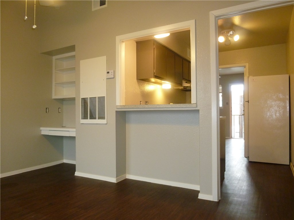 3000 Guadalupe Street, Unit 313 Austin, TX 78705 - Photo 4 of 14 a view of empty room with wooden floor