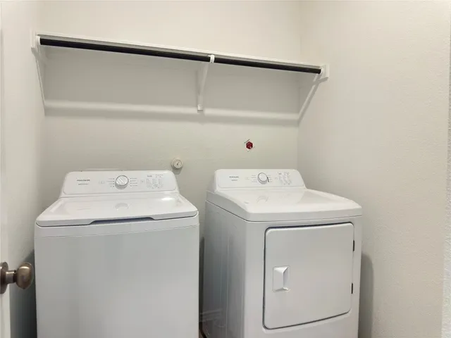 a utility room with dryer and washer
