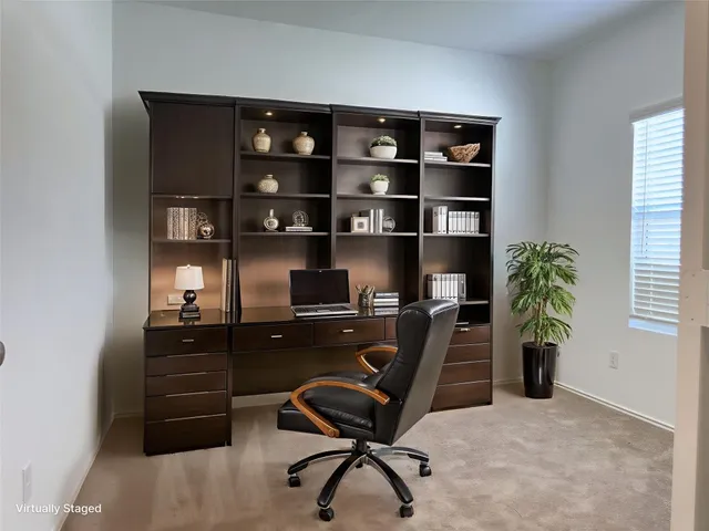 a view of a workspace with furniture