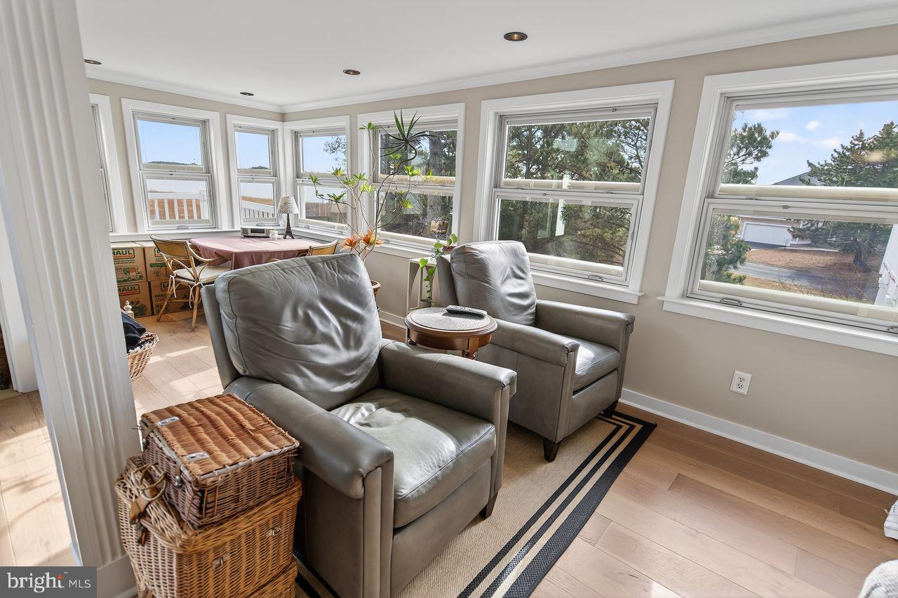 30470 Shore Lane, Unit 5 Ocean View, DE 19970 - Photo 15 of 56 Enclosed Sunroom with Column Trim.