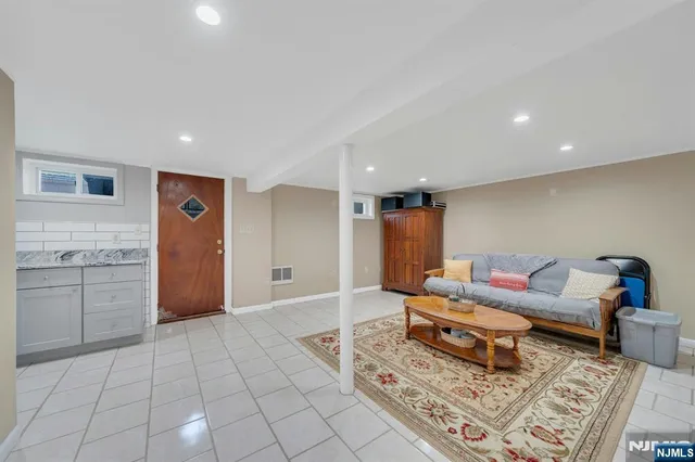 a living room with furniture and a rug
