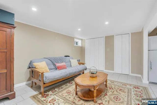 a living room with furniture and a rug