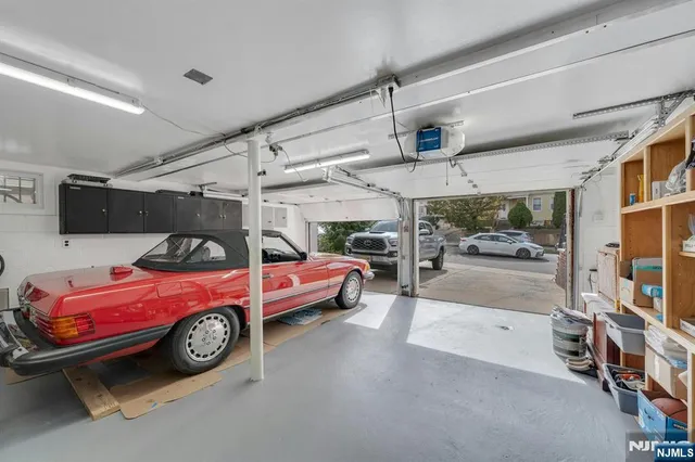 a view of a garage with cars