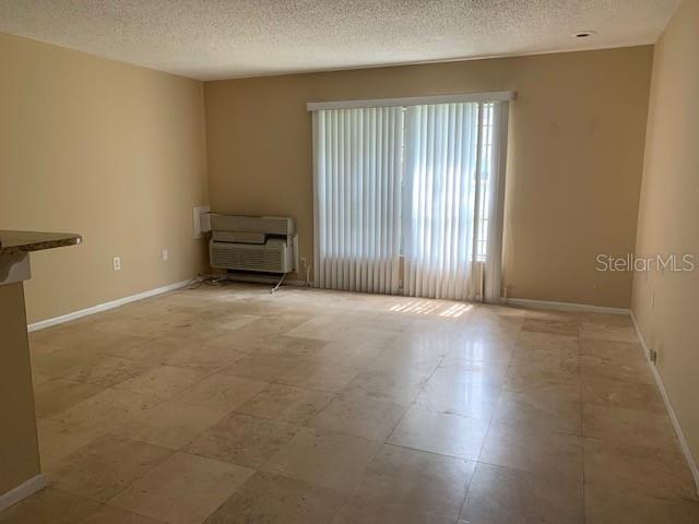 120 America Street, Unit 7 Orlando, FL 32801 - Photo 2 of 13 an empty room with windows