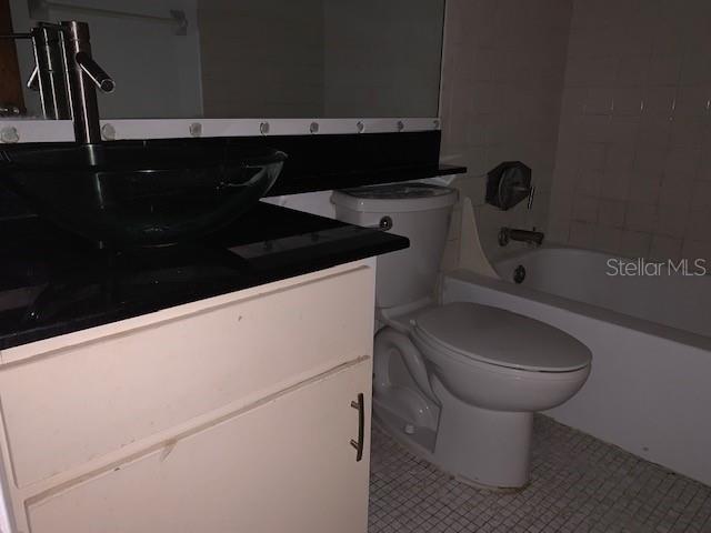 120 America Street, Unit 7 Orlando, FL 32801 - Photo 10 of 13 a bathroom with a sink and a toilet