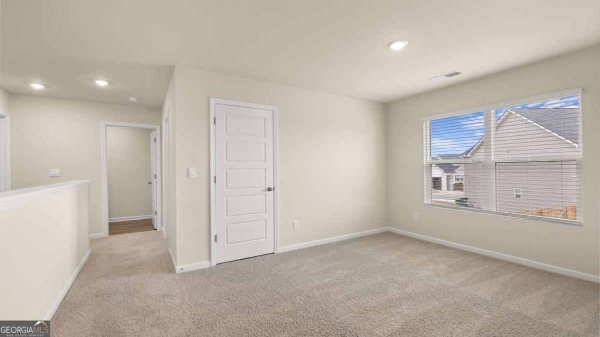 100 Planters Row Perry, GA 31069 - Photo 14 of 37 a view of an empty room with a window