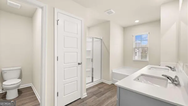 a white bath tub sitting next to a white sink