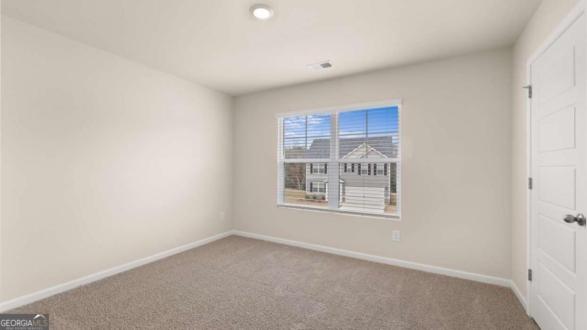 100 Planters Row Perry, GA 31069 - Photo 30 of 37 a view of an empty room with a window