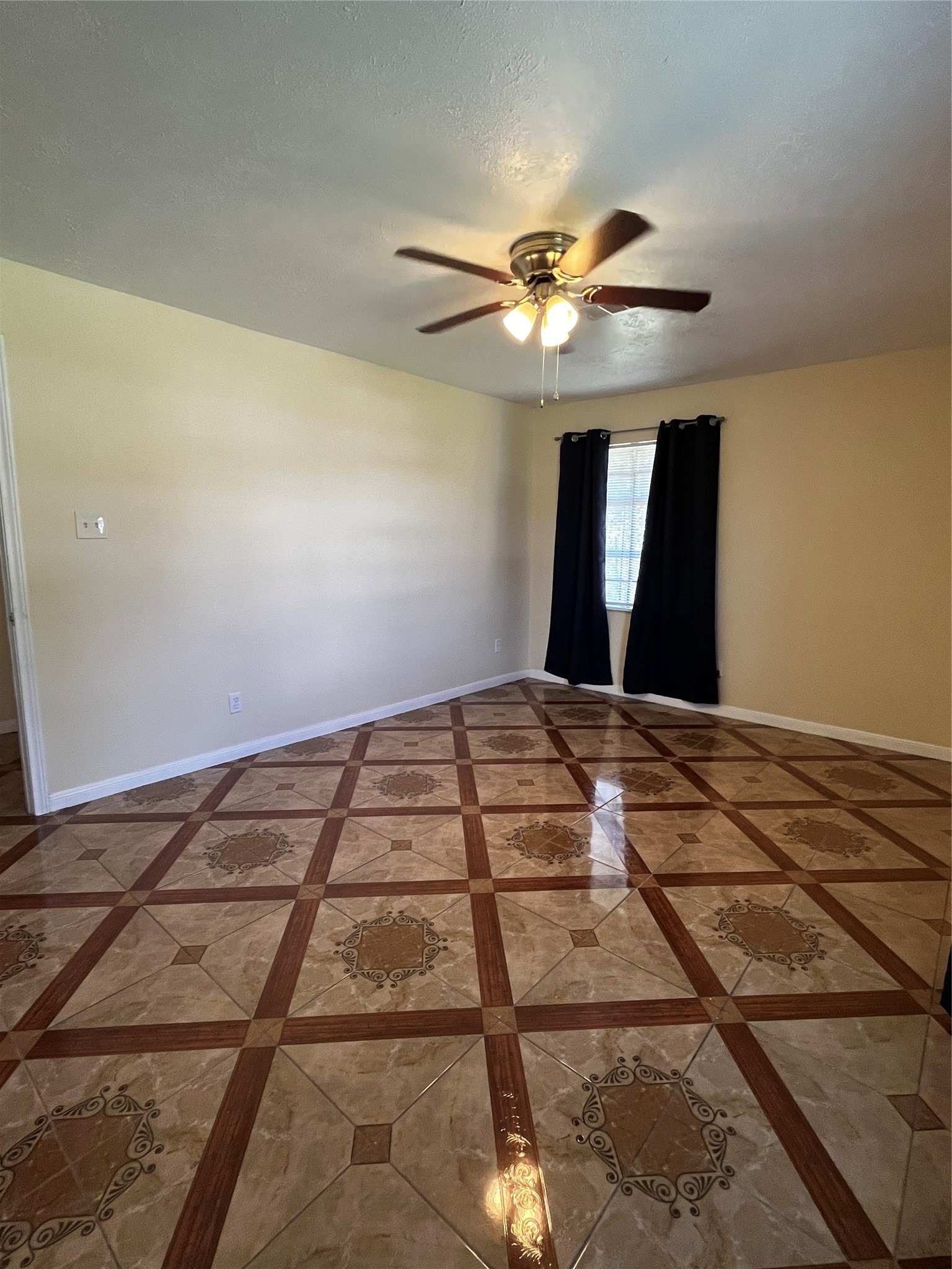 3163 Roe Drive Houston, TX 77087 - Photo 45 of 47 a bedroom with a large bed and ceiling fan