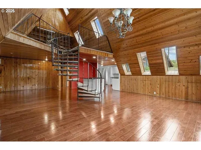 a view of a livingroom with wooden floor