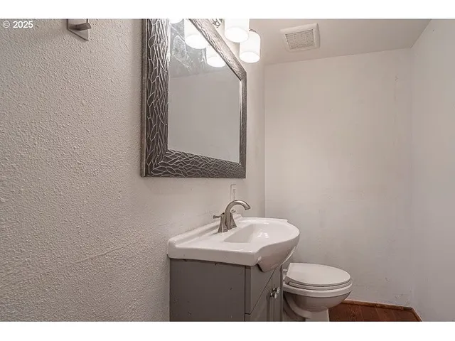 a bathroom with a sink and a toilet